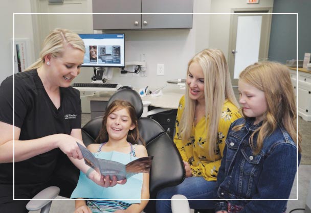 dental assistant speaking with family