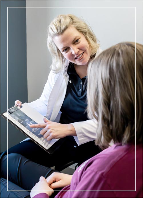 dentist speaking with patient